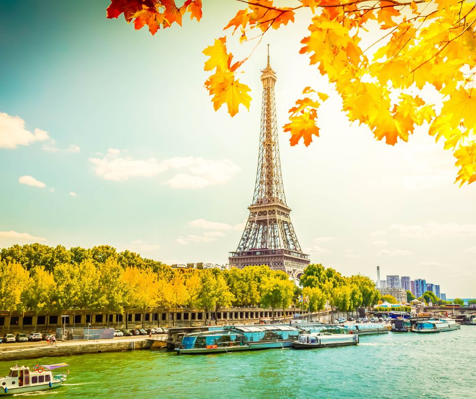 International tour package image with suitcase, Eiffel Tower, Statue of Liberty, Big Ben and world landmarks